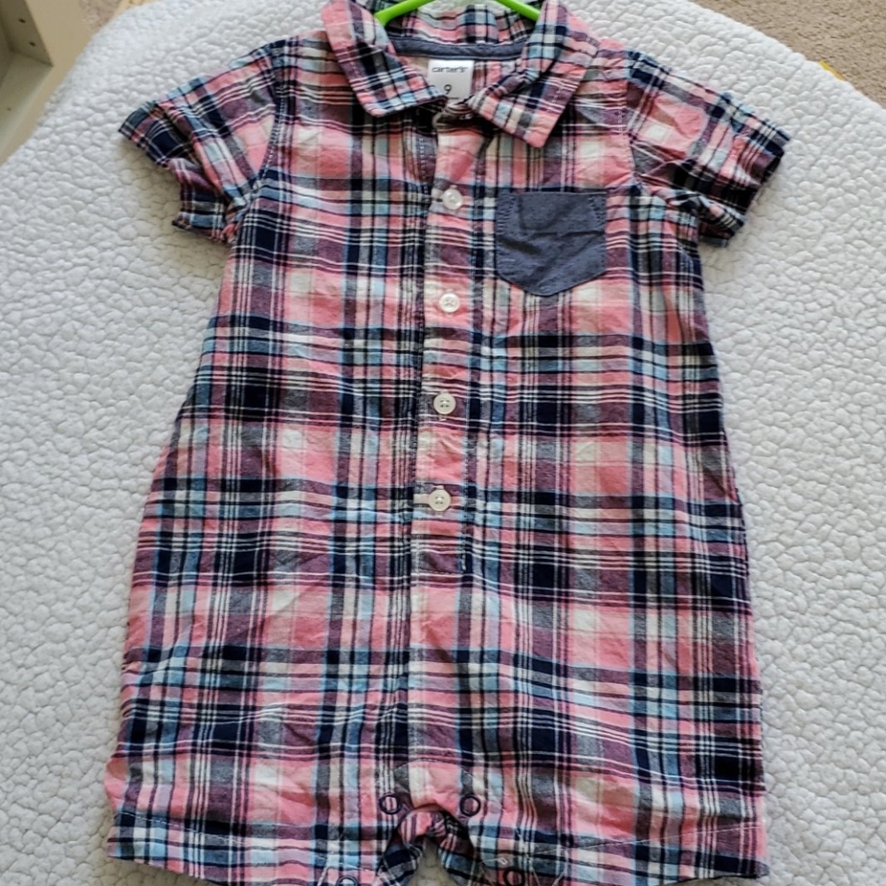 One piece button down short outfit.